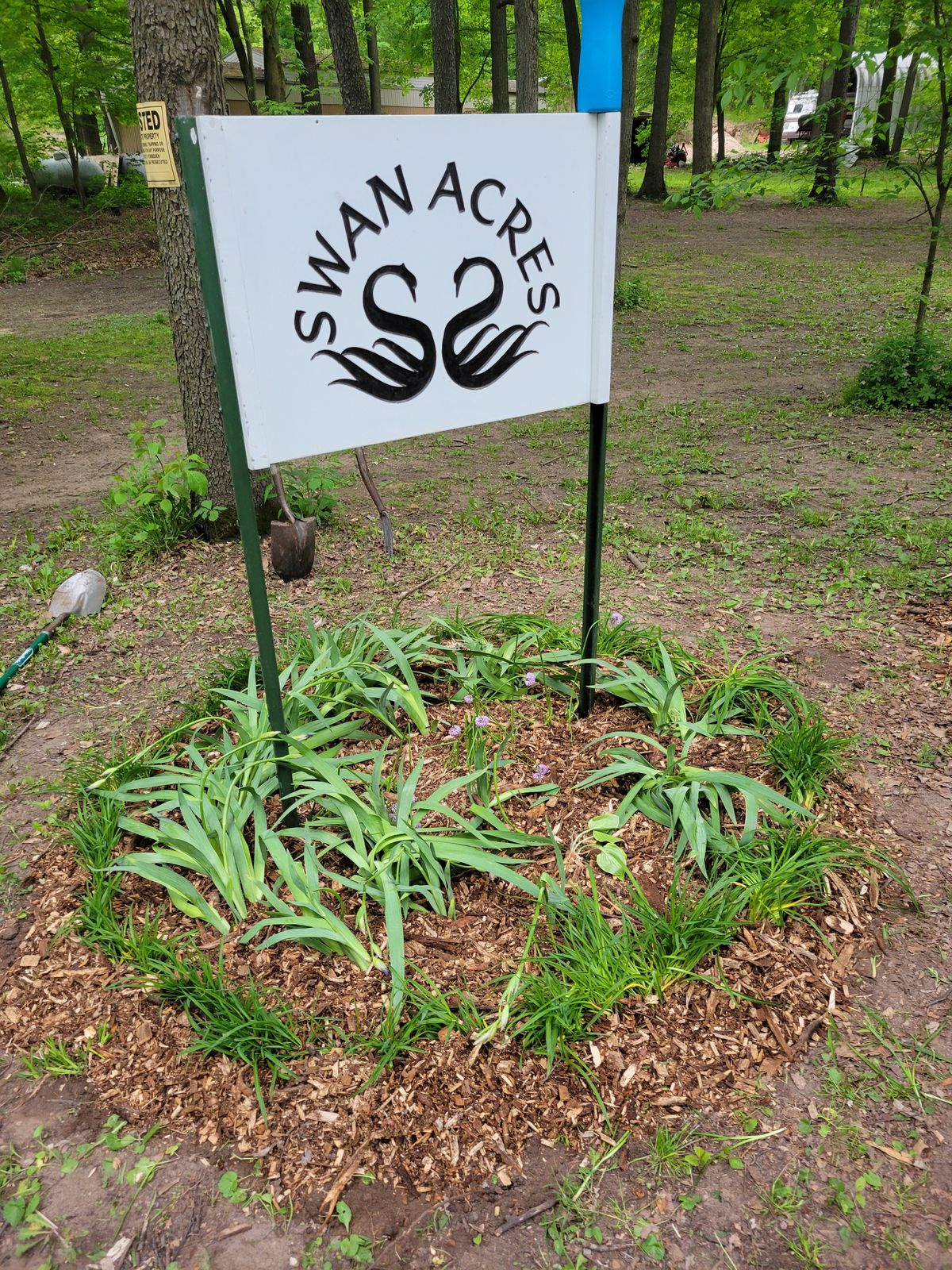 New flower bed around road sign