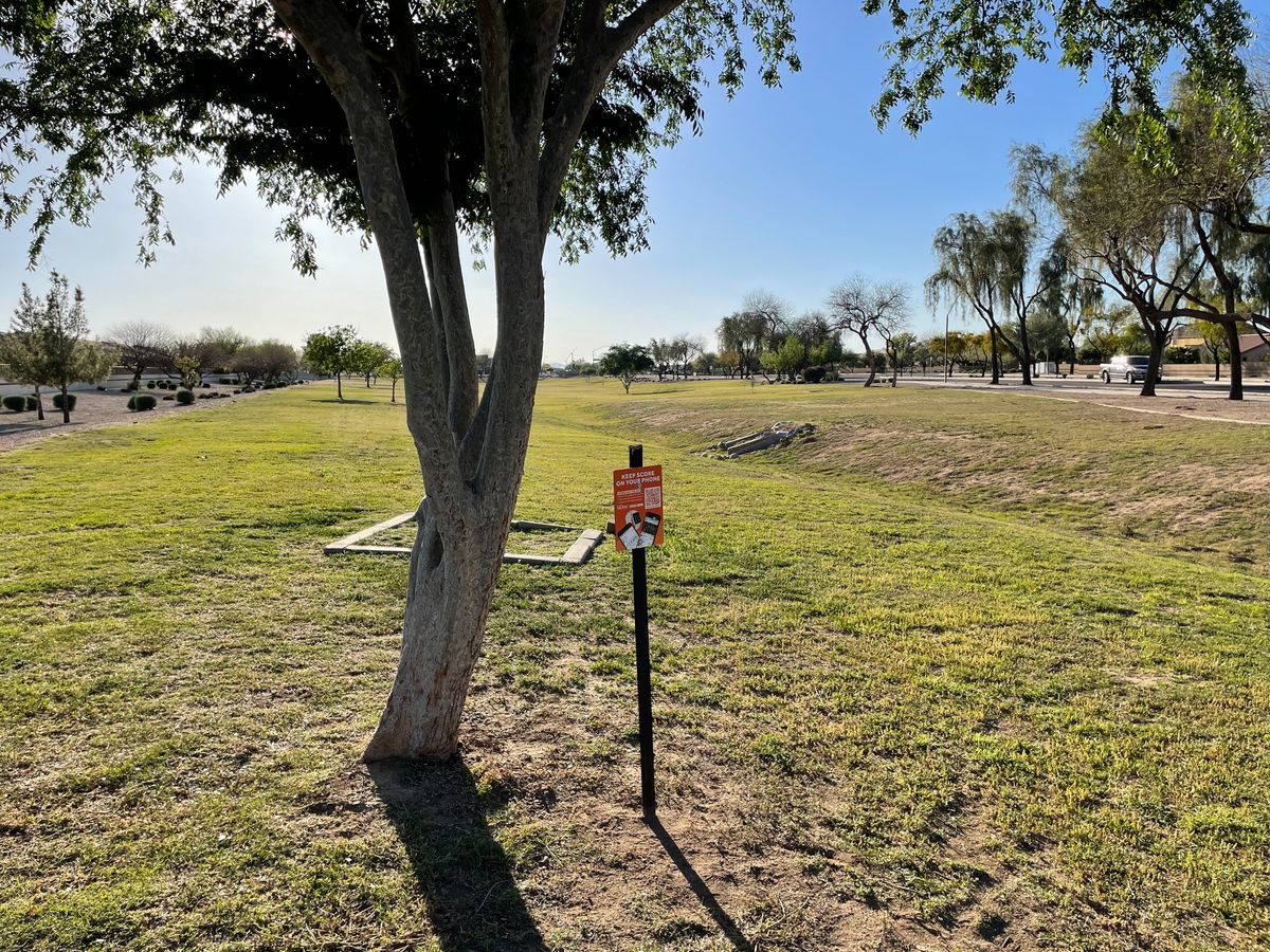 UDisc sign on 1st and 10th tee