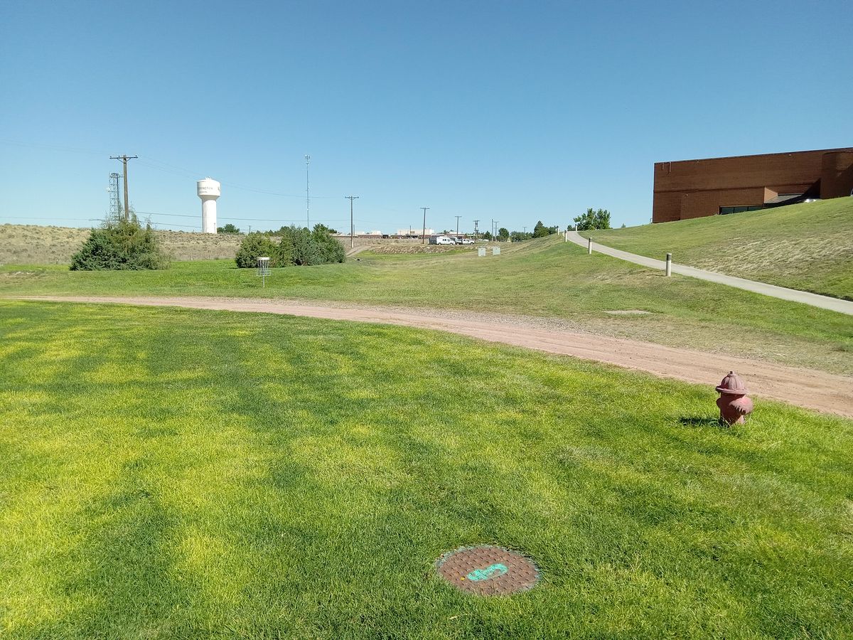 Neo Layout hole 3. Tee off from left of manhole(grass) basket #3 (white number on basket.)