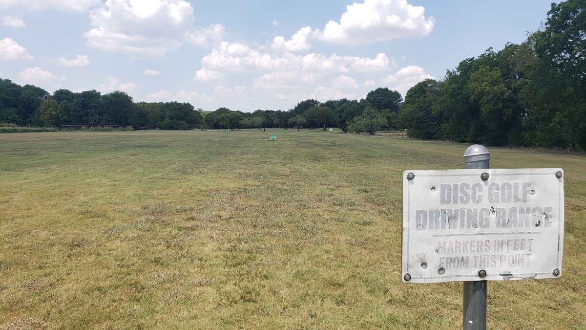 Driving range with distance markers.