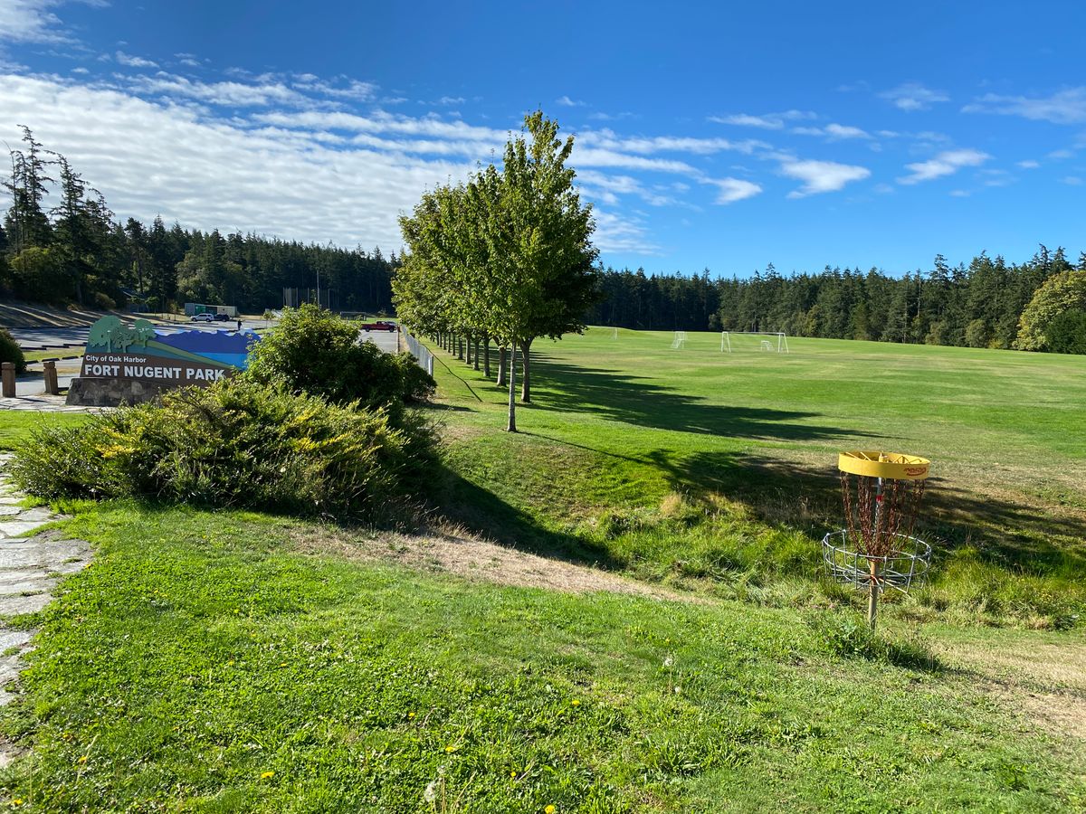 Hole 18 and park entrance sign.