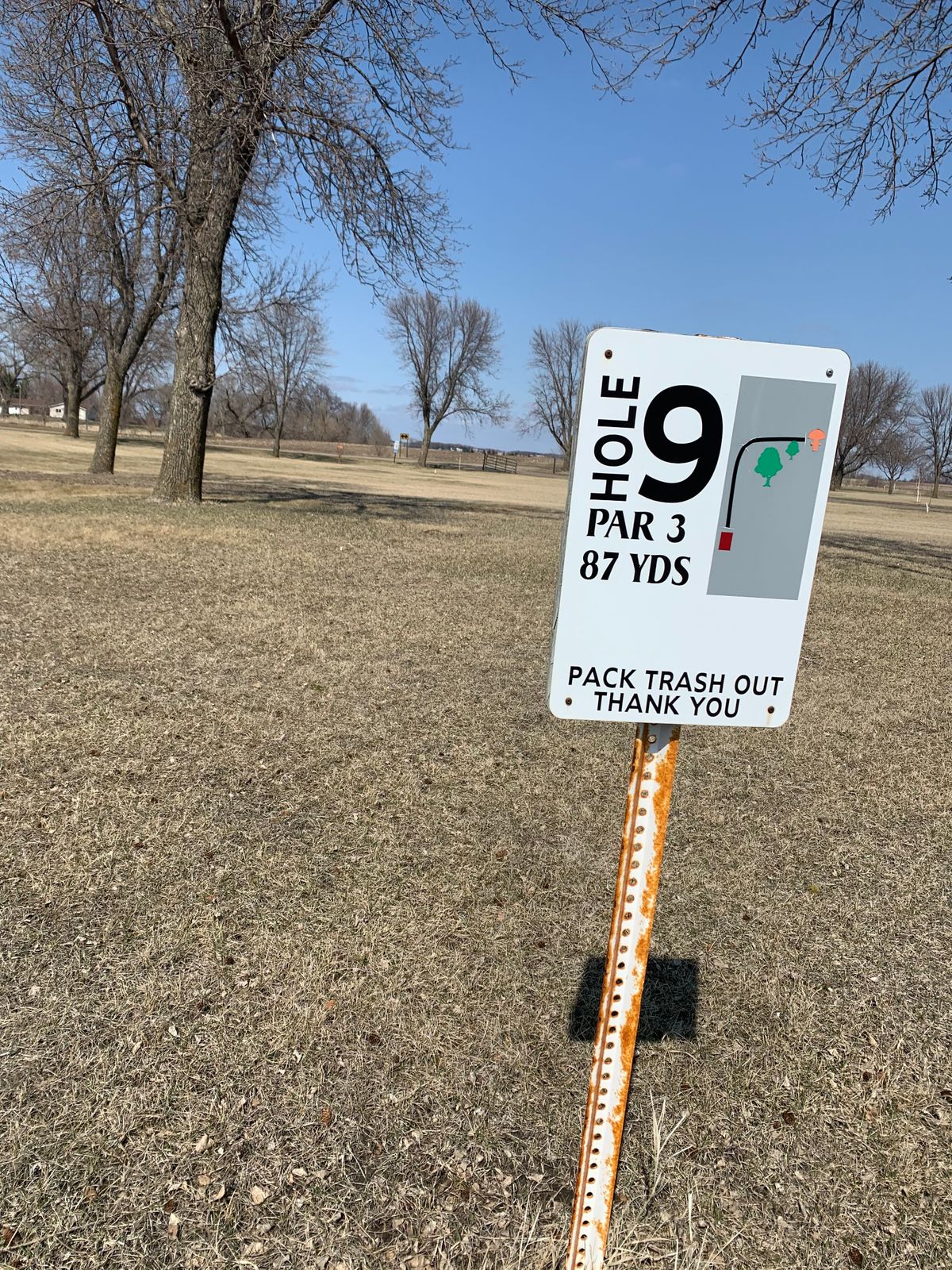 View of tee sign at hole 9.