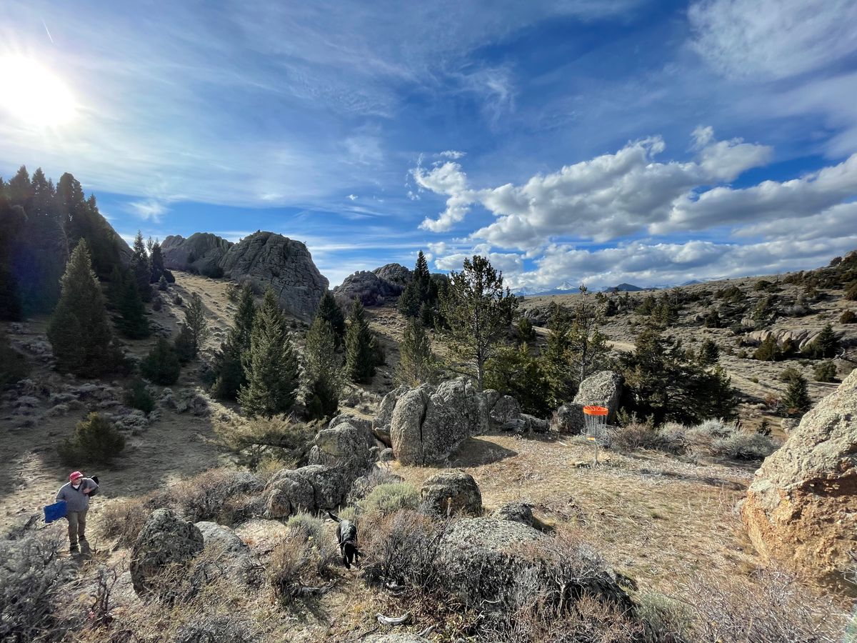 Green of #9 West/Double Canyon with the southern end of the Tobacco Root Mountain Range in the distance.