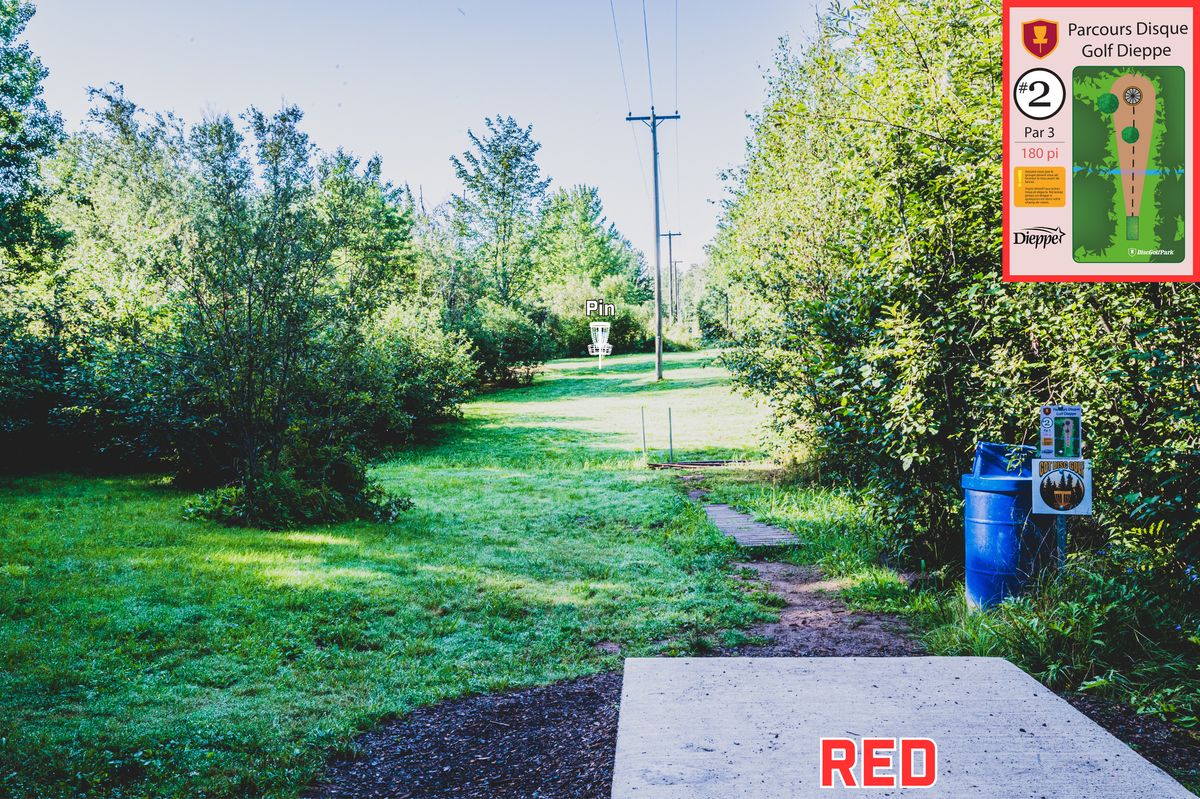 Hole 2 Red Tee - Throwing over a small creek with water.