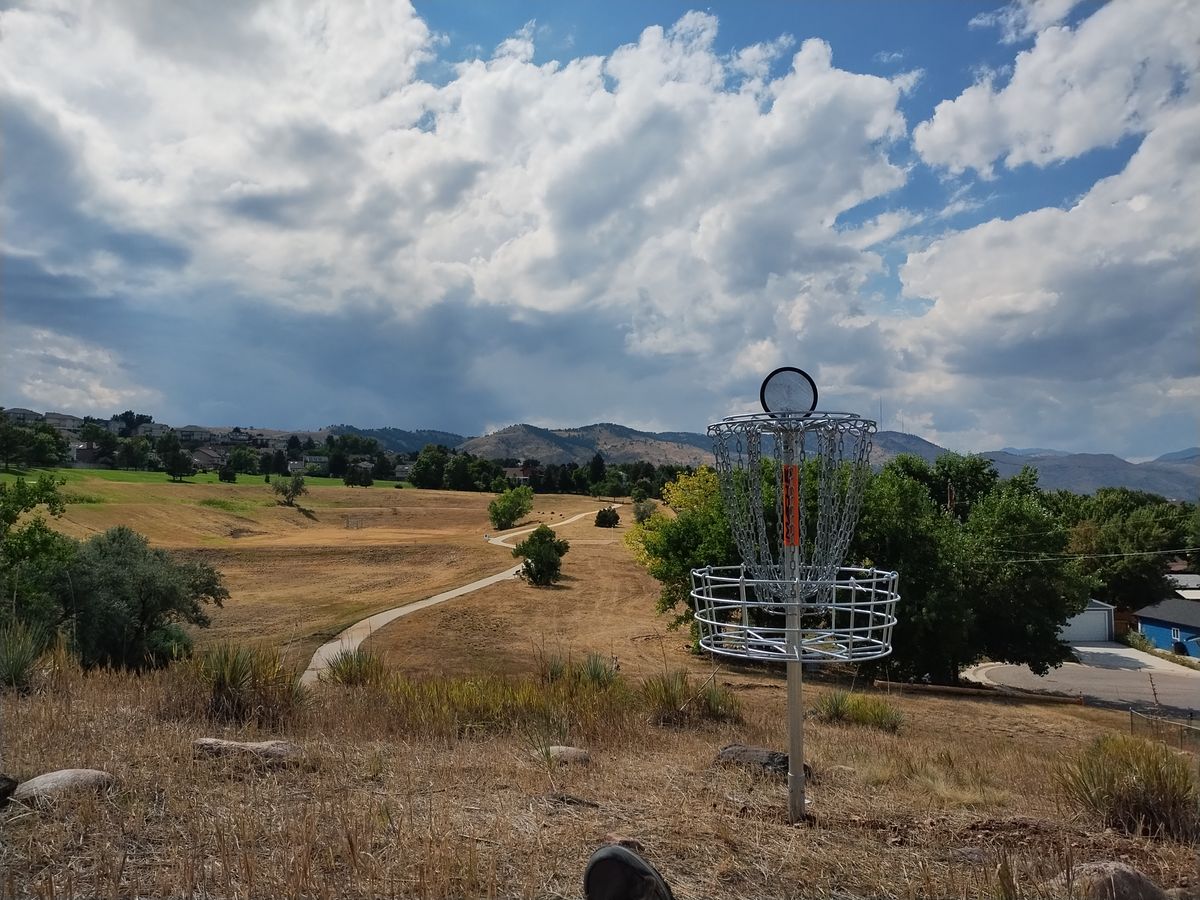 Hole 12, hole 11 behind in tree downhill. 10, 1, and front 9 in