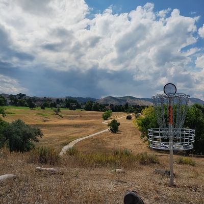 Hole 12, hole 11 behind in tree downhill. 10, 1, and front 9 in