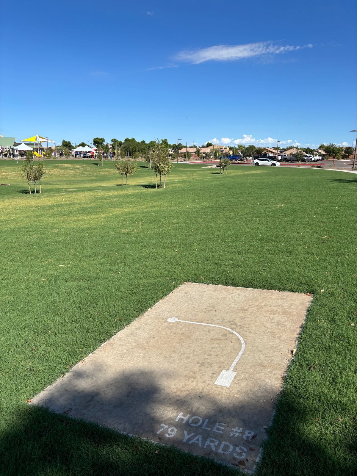 Mando right, first tree on left. Sidewalk, rock boarder & beyond OB