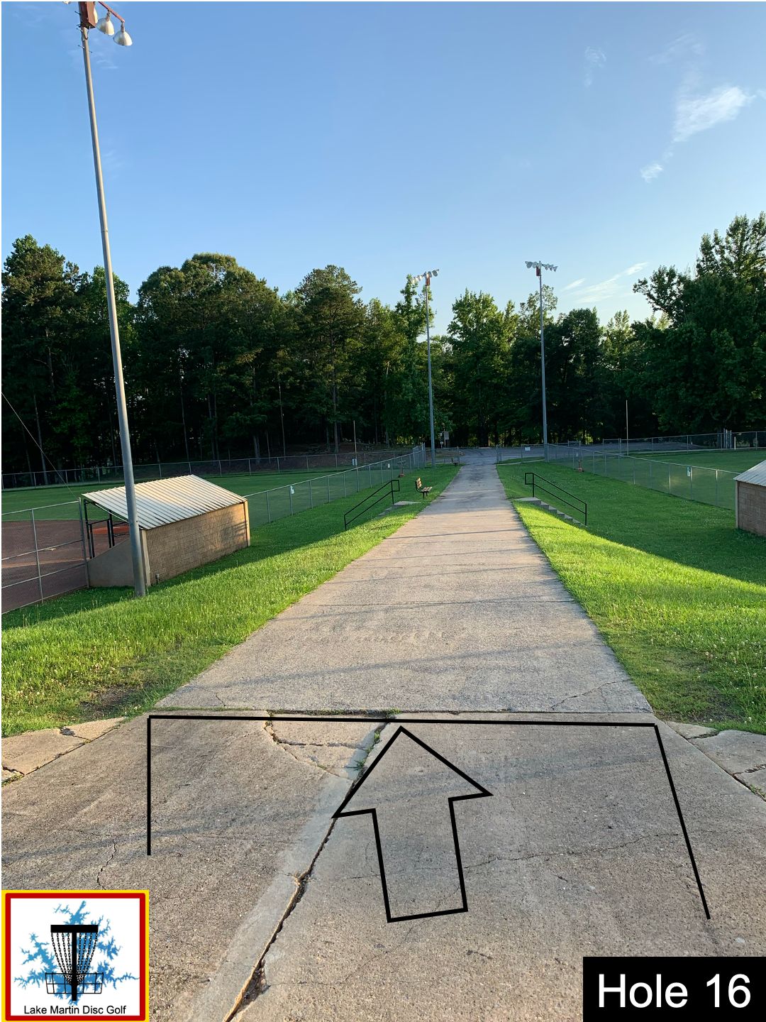 Concrete slab line before the baseball field divider walkway between holes 7 and 8 to 8th basket