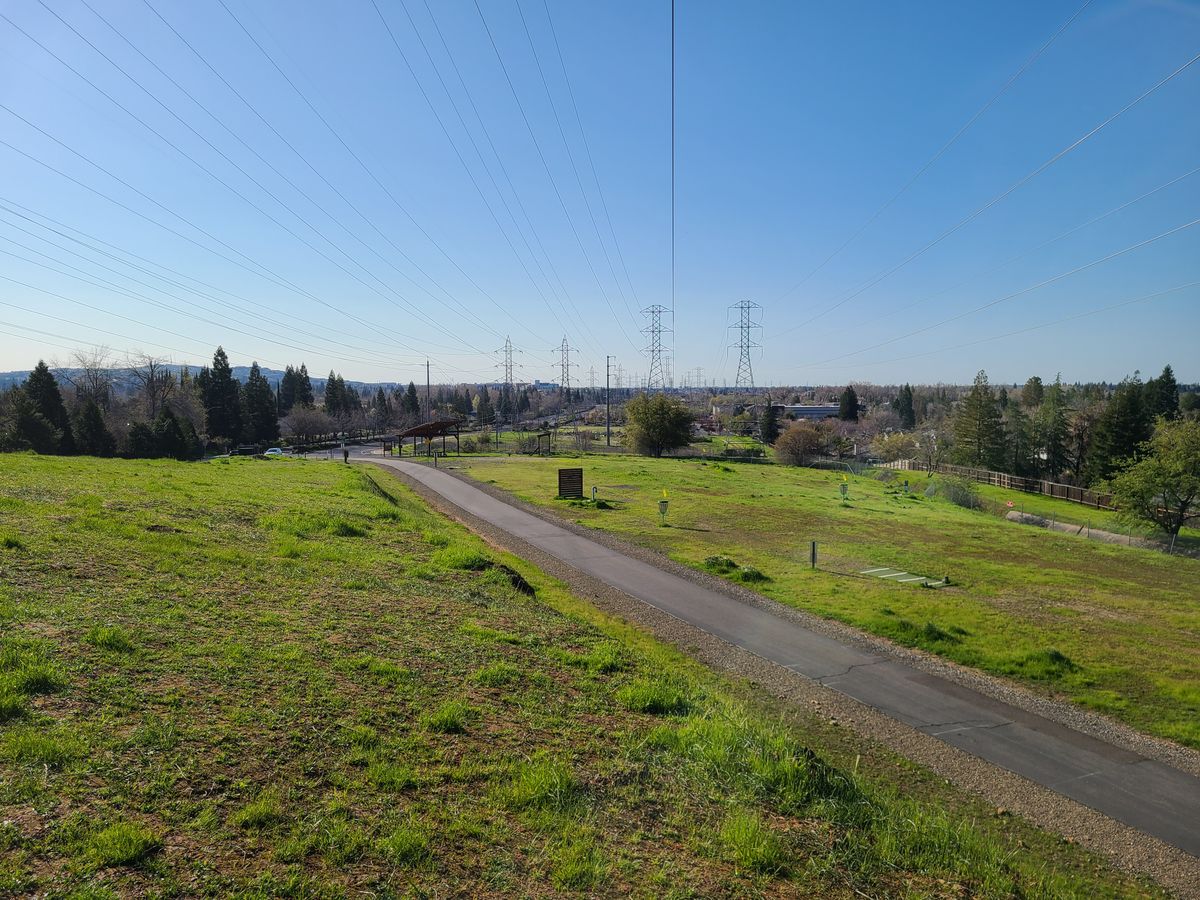 Looking back from the basket of hole 1/10. Looking down on the 4 pitch and putt holes.