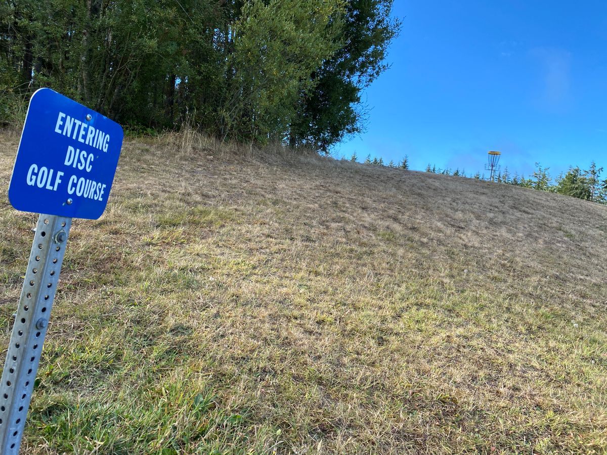 Great use of elevation on Hole 2. The backside falls off. Also, Disc Golf warning signage.