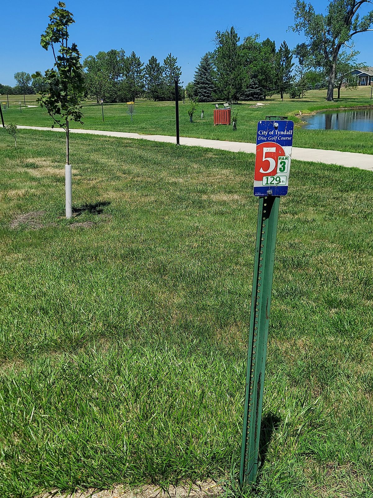 Hole 5 teepad, short 129' shot with water in play to the right