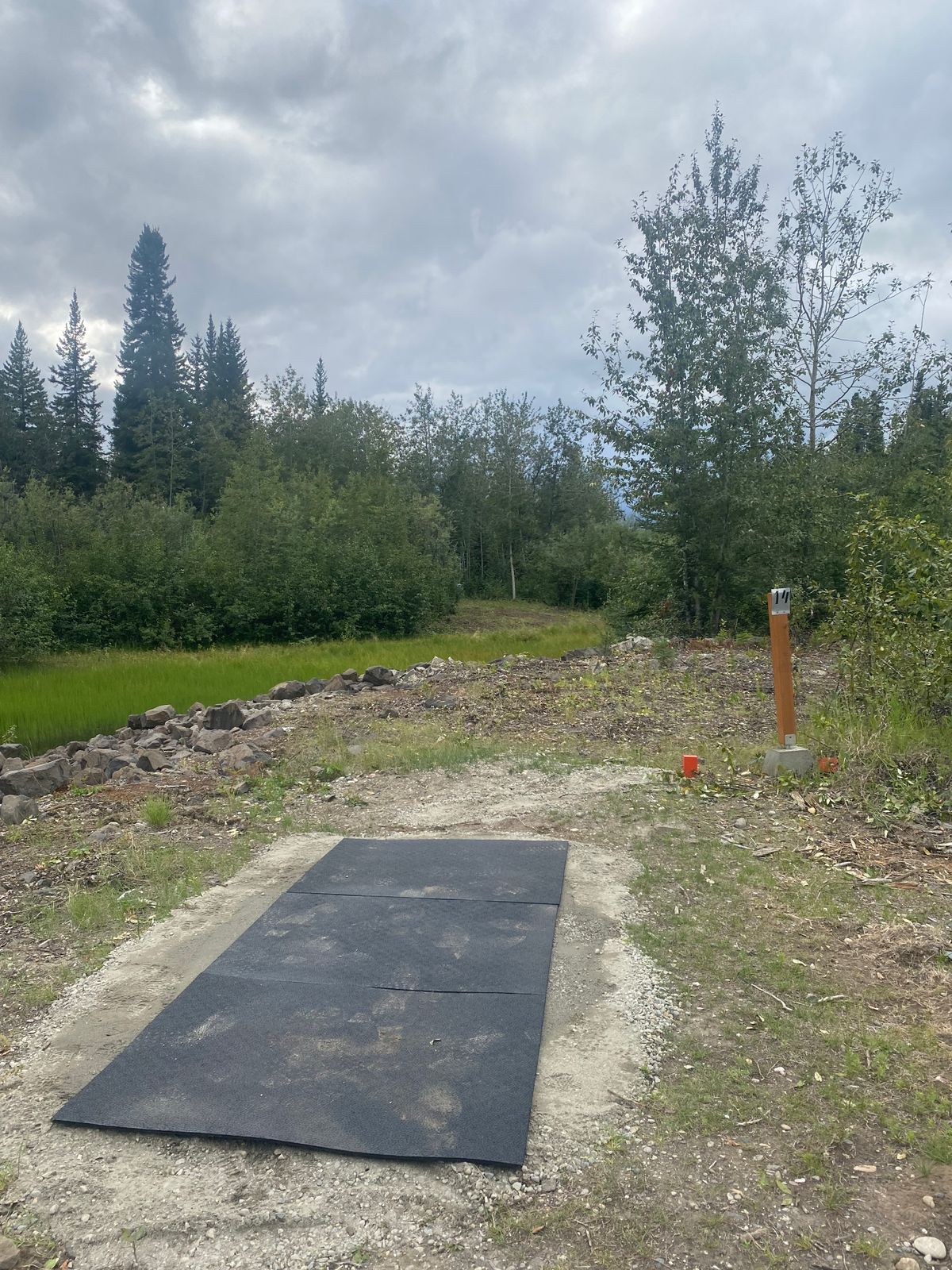 Hole 14 Tee pad with the only water carry on the course
