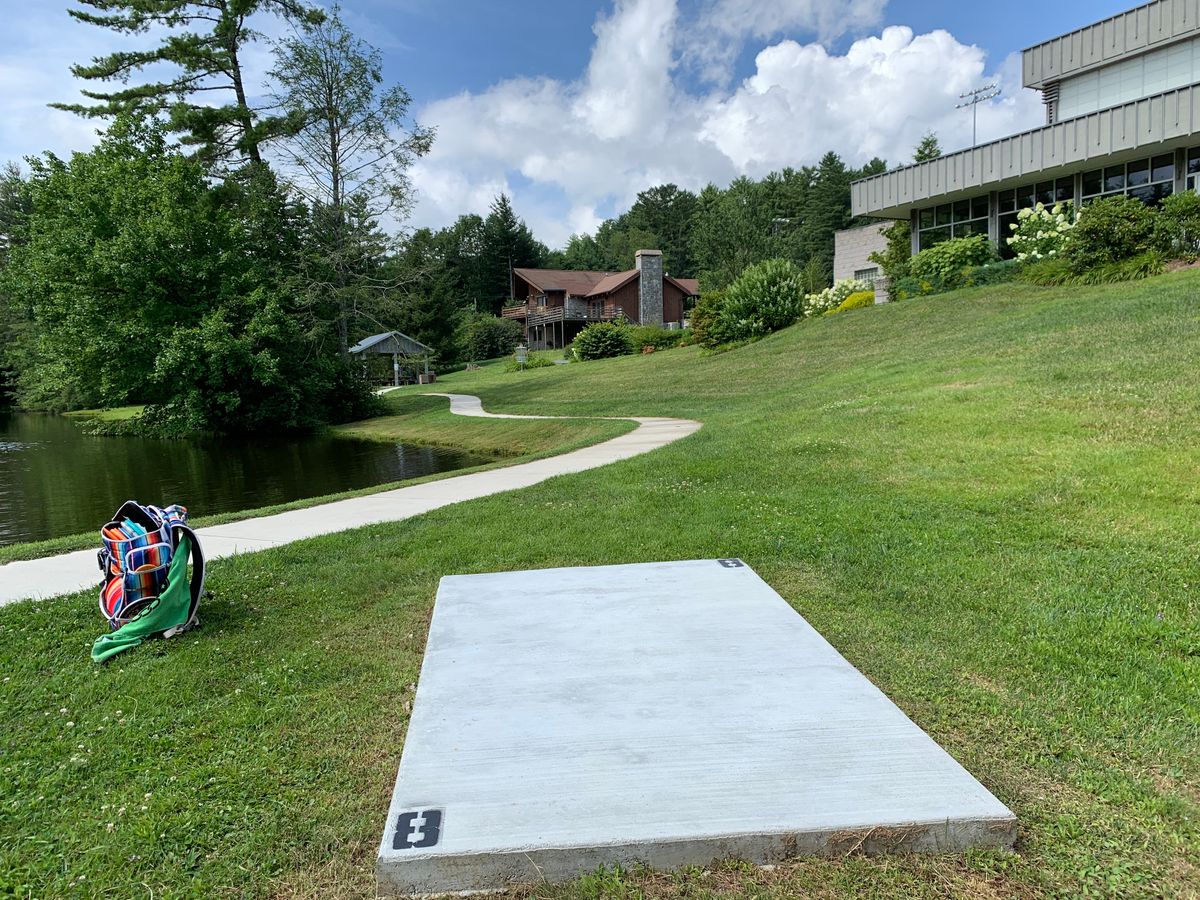 8-straight short, top of hill. Disc can roll down to water.