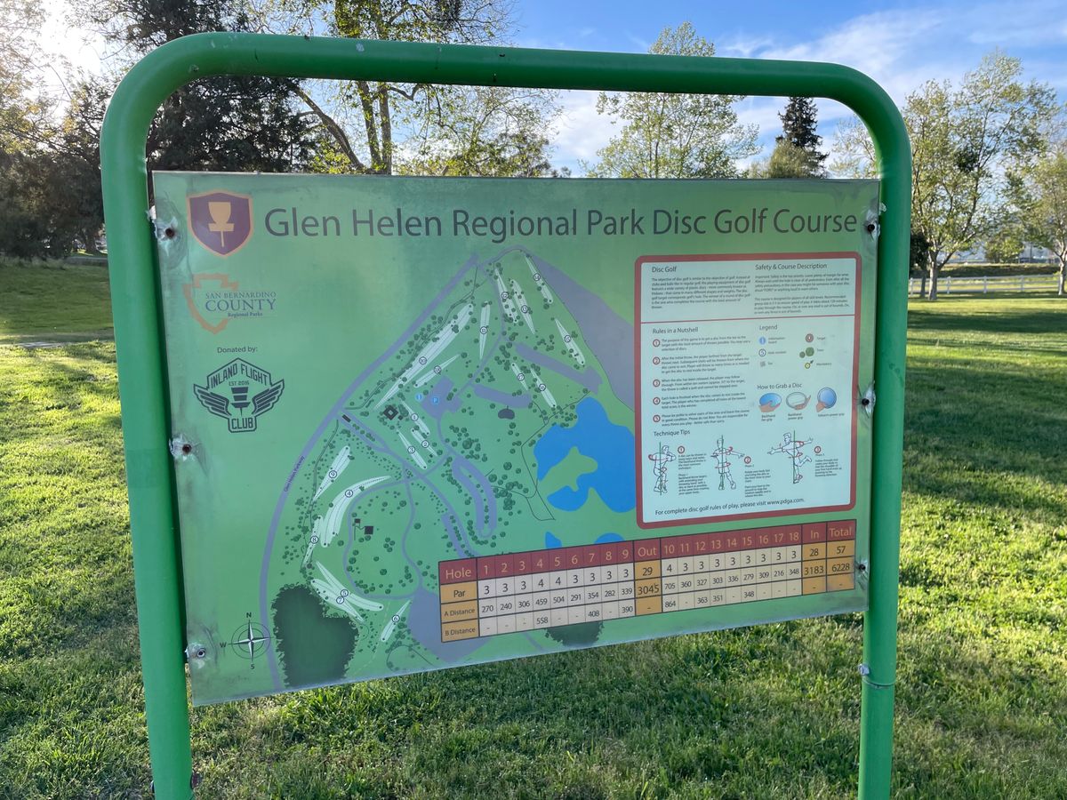 Course map near parking lot and basket 18