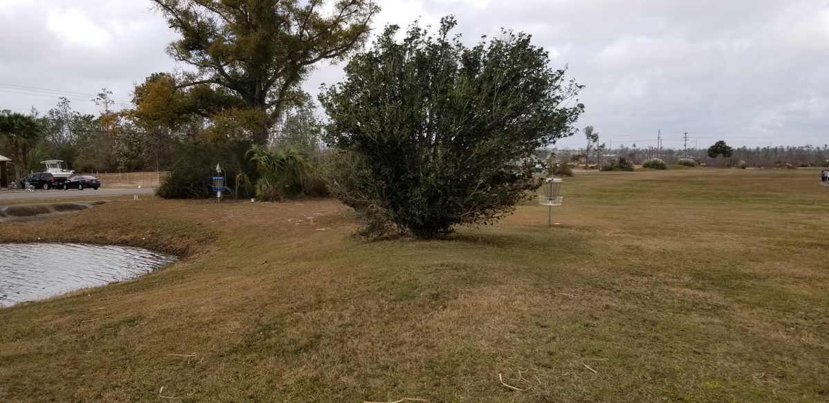 Hole 1 fairway (white and blue baskets visible)
