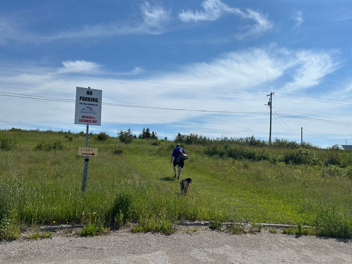To get to #1 tee pad, walk to the cul-de-sac at the far end of the town office building, then proceed up the hill. 