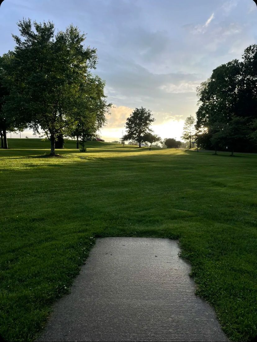 Hole 18 on a beautiful afternoon.  This hole climbs gently up hill the length of the whole.  Hole 18 finishes next to number one pavilion and is a short walk back to the parking lot to finish your day.