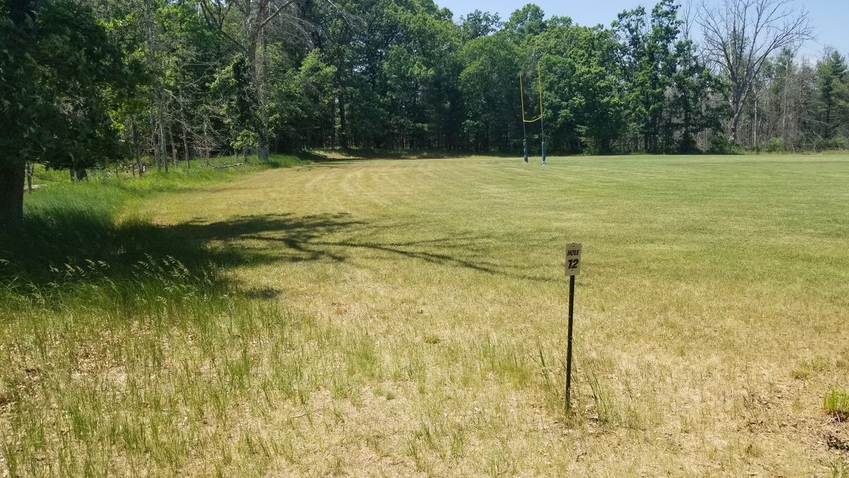 Hole 12. Long drive, then once you hit the woods can see basket in deeper.