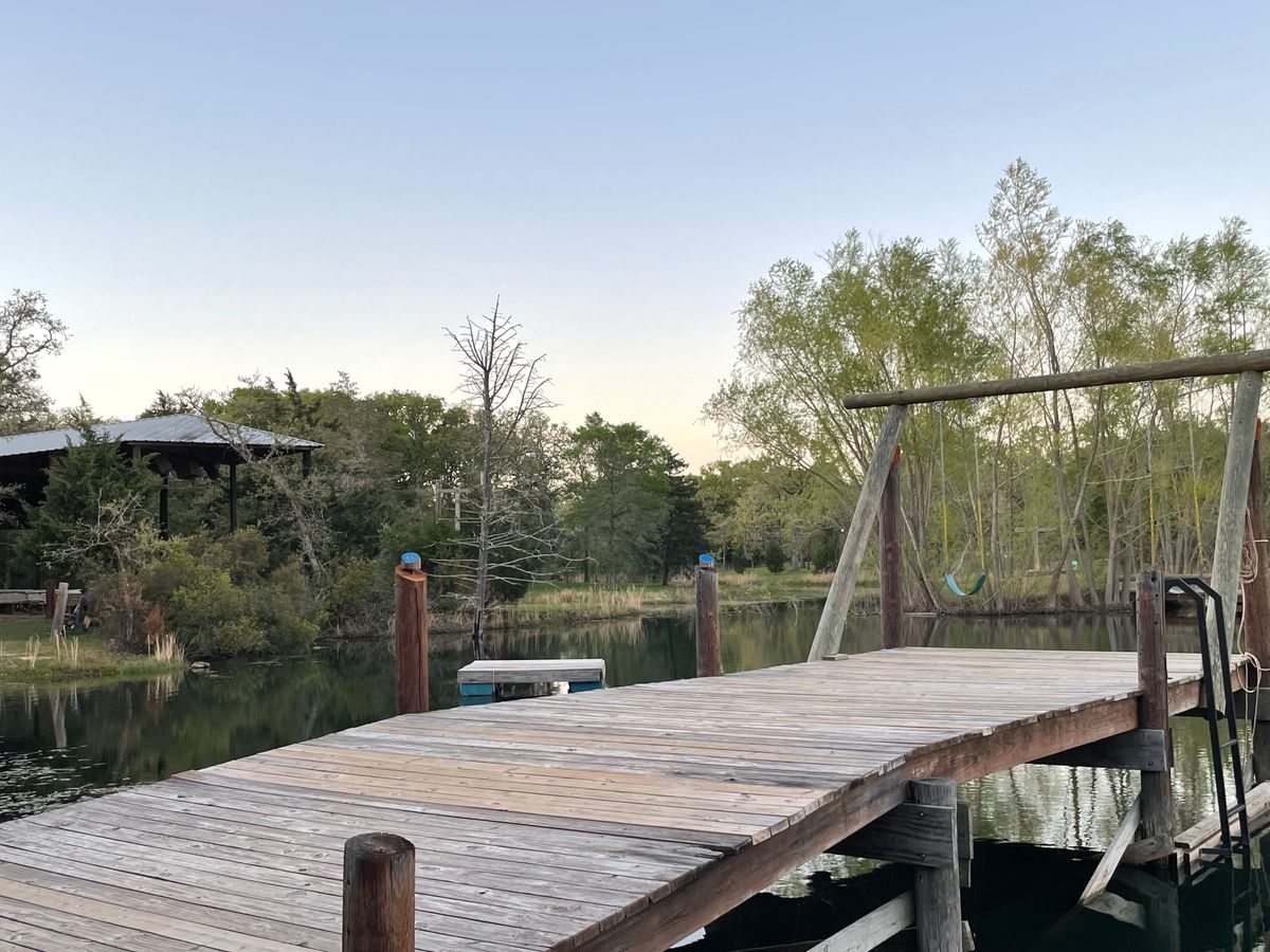 The dock serves as the tee pad for this hole. You throw between the two posts with blue markers.