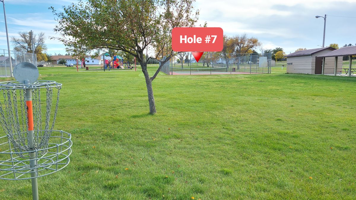 Hole 7 plays over the tennis courts.