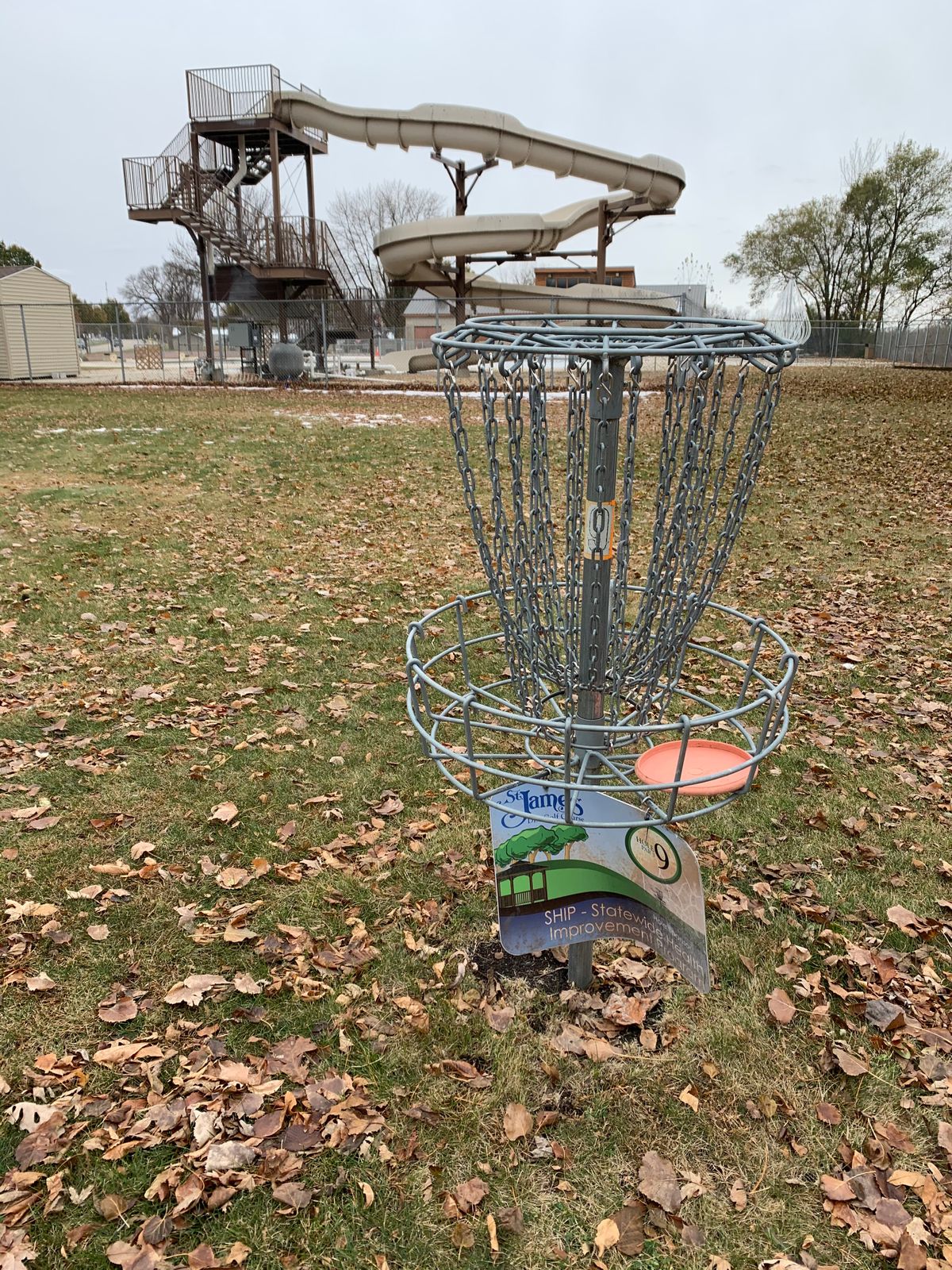 Hole 9 near the pool/slide. Hole 1 & hole 9 are near the pool. Holes 2-8 in the park area.
