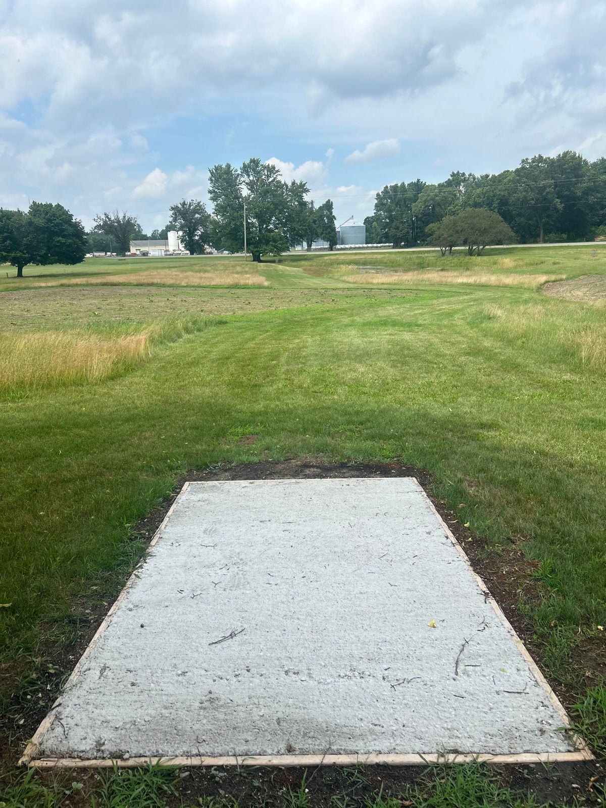 Hole 14- slight down hill with water hazard on the right.