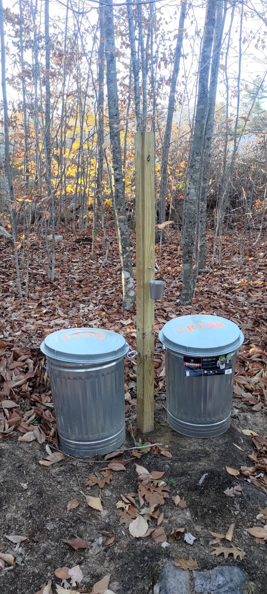 These trash cans an cigarette buckets are at every hole.