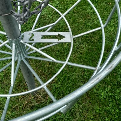 Next tee signage/arrow built into the bottom of the baskets.