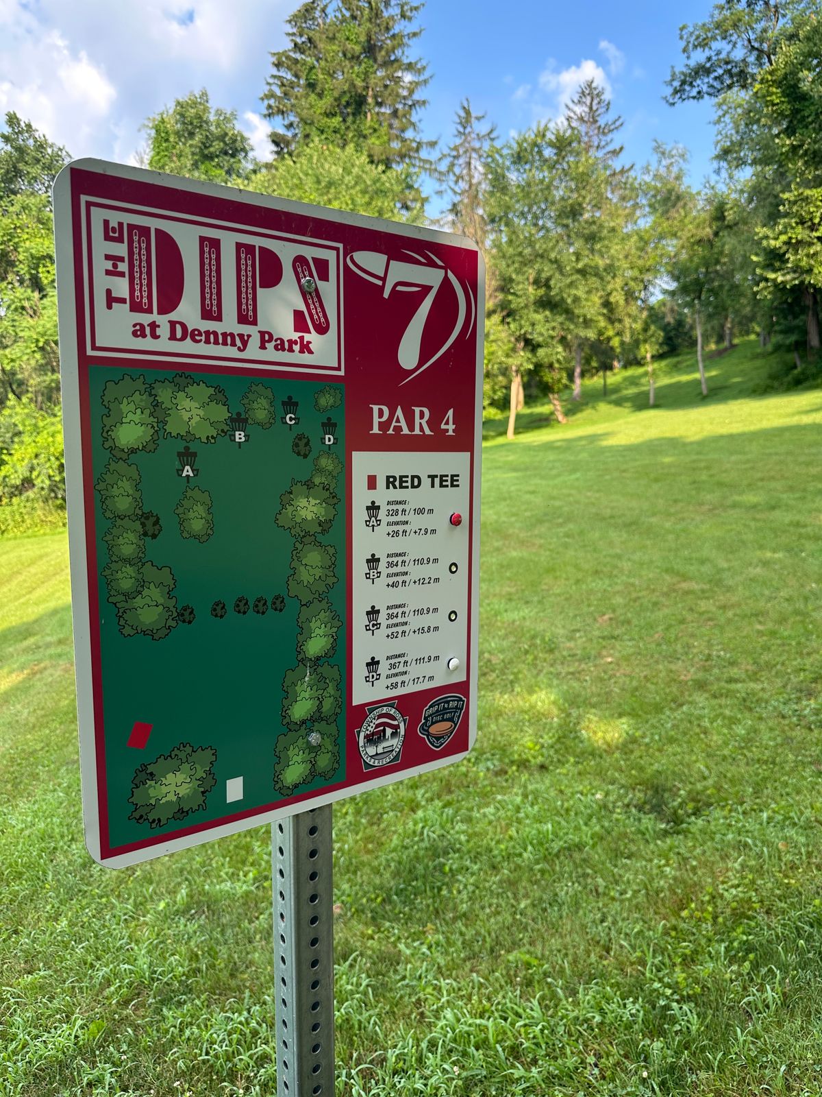Hole #7 tee sign. Button indicators were super helpful for pin placements.