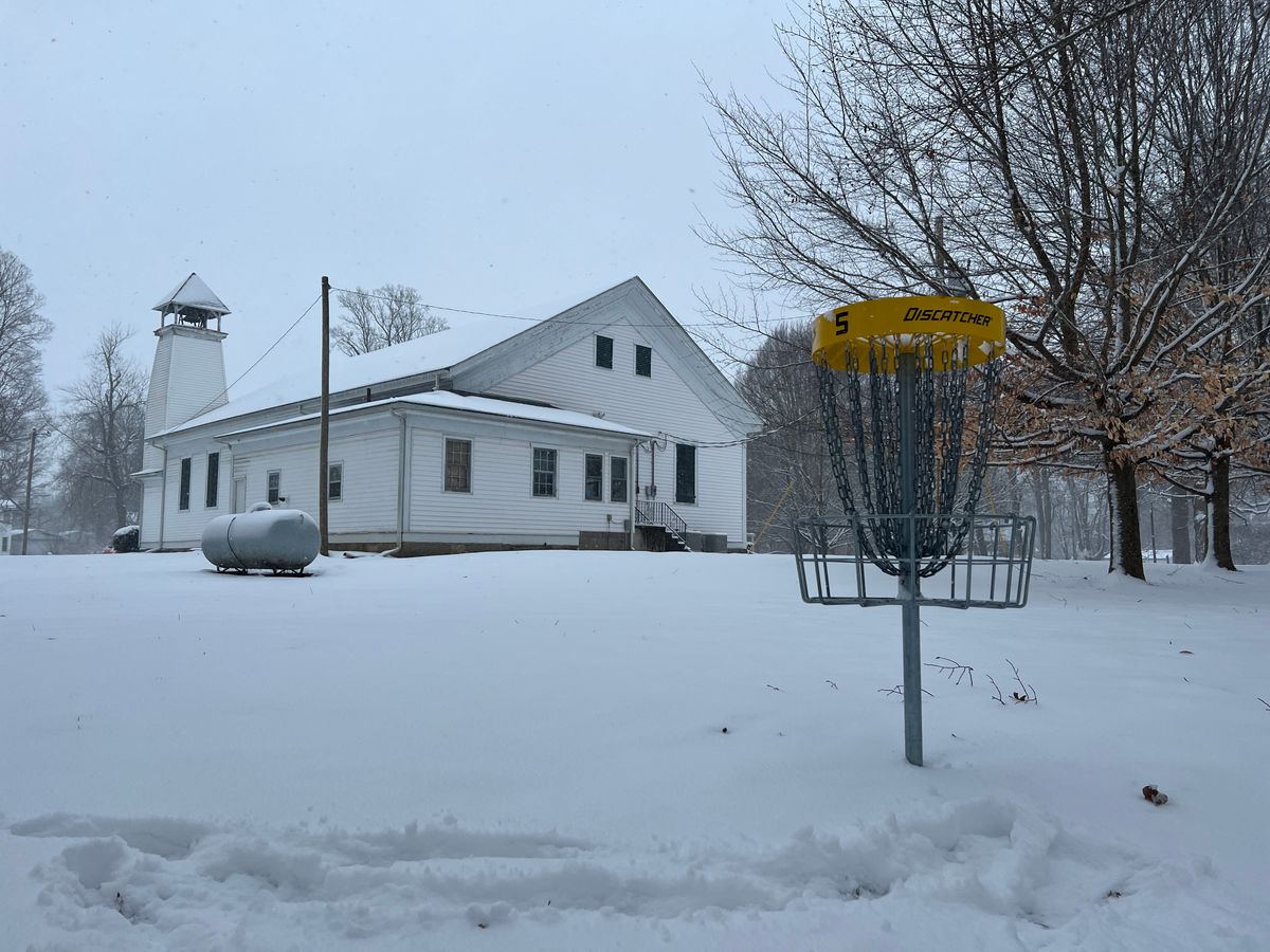 Hole #5 Basket with church in background