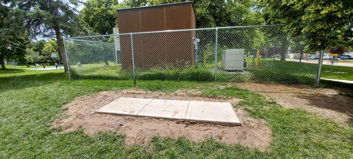 5th Tee Platform is behind this storage area. The basket is in the field to the right side of the basketball court. On the other side of fenced off area & trees.

Watch out for others. Basket is on other side of walking path & blind spots while throwing.

*This is the 14th hole as well, if you are using the 18 hole scorecard.