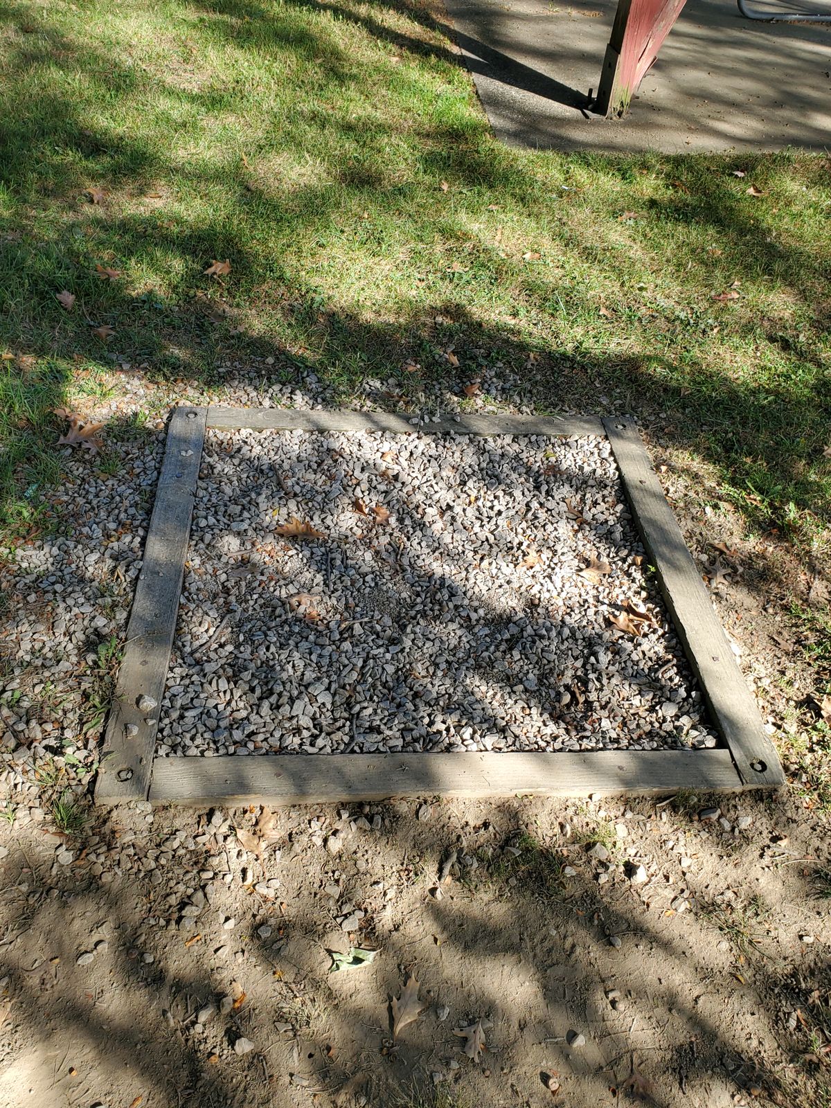 The gravel squares used as tee pads.