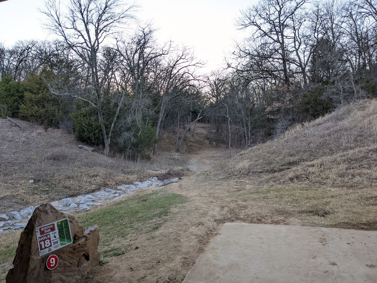Hole 18 - narrow fairway to the steep incline, dogleg left at the plateau.