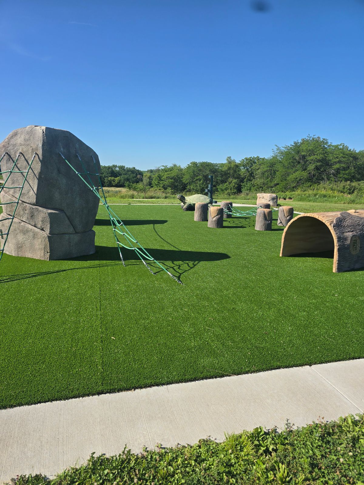 The park between holes 1 and 9. There is a water fountain for people and dogs here.