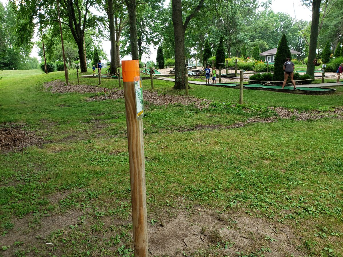 #2 Pro Tee sign post facing the mini-golf course.