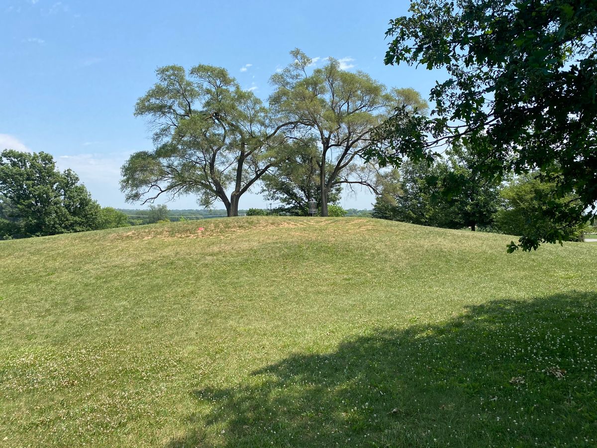 Base of hill rising to 10’s basket