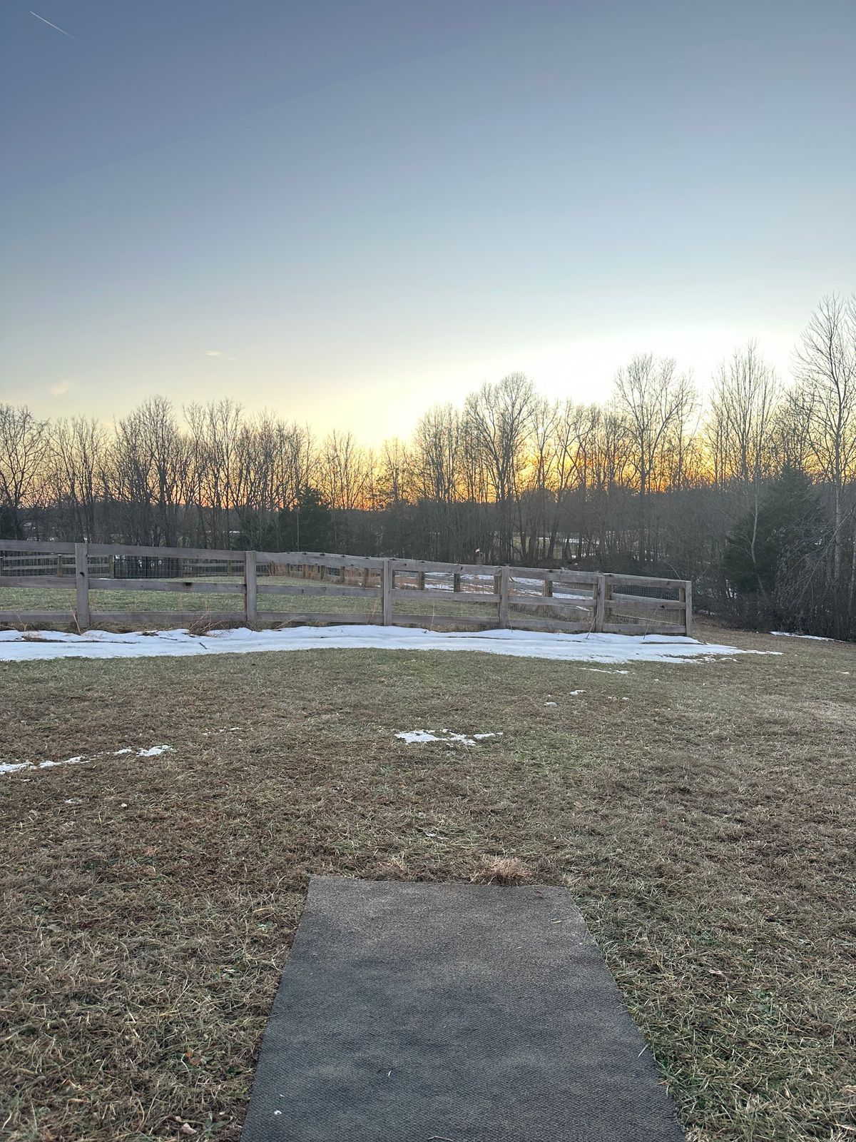 Hole 15 tee pad, in fence is OB