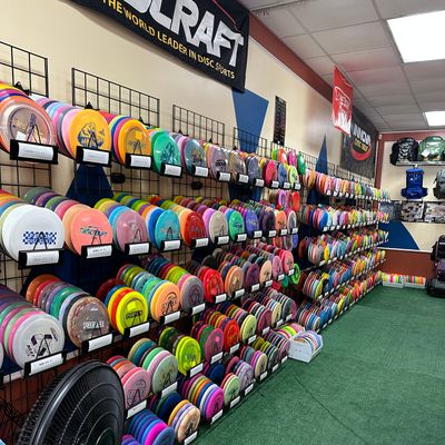 Discraft, DGA, Lone star discs wall.