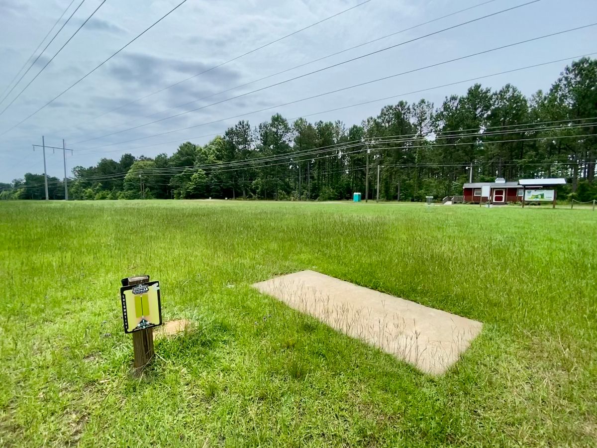 Hole 1 Tee with clubhouse in background. Normally not manned.