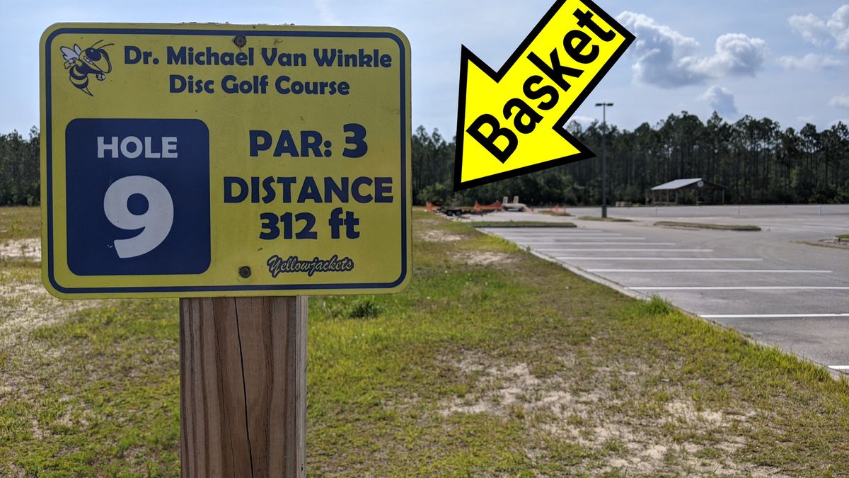 Just behind the corner of the parking lot and, for us, over the rebar for the construction. Pavilion and 1st tee to the right.