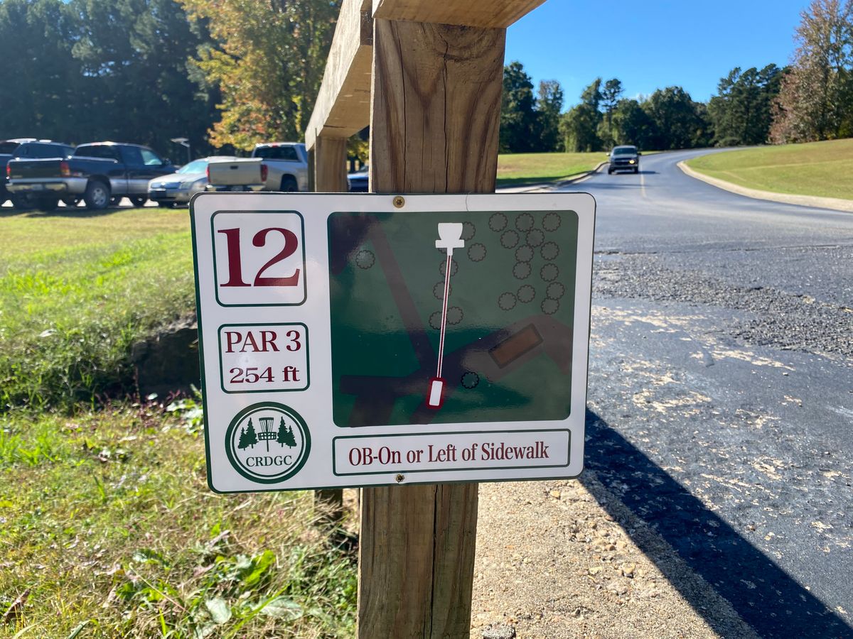 Hole 12 sign (red/white)