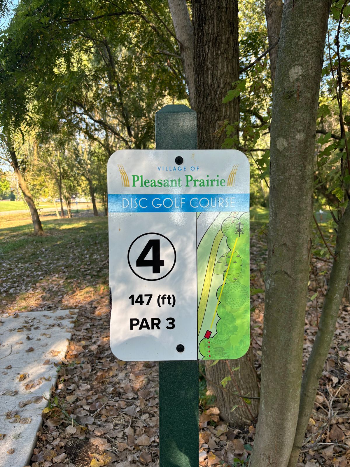 Hole 4 sign. Basket in background.