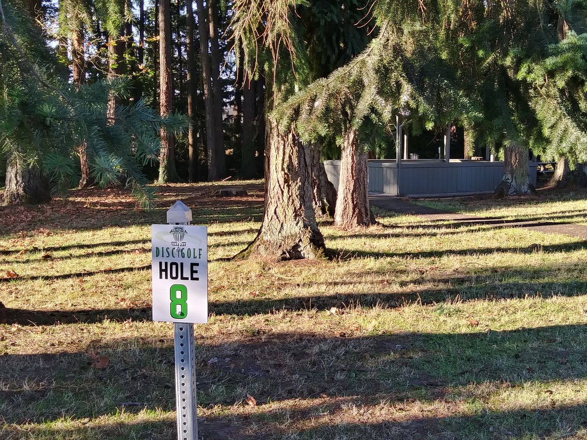 Hole 8. Basket visible behind building.