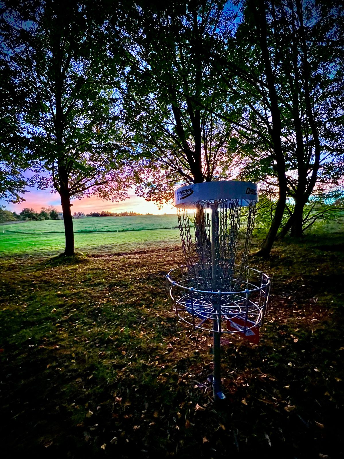 Hole 1 green at sunset.