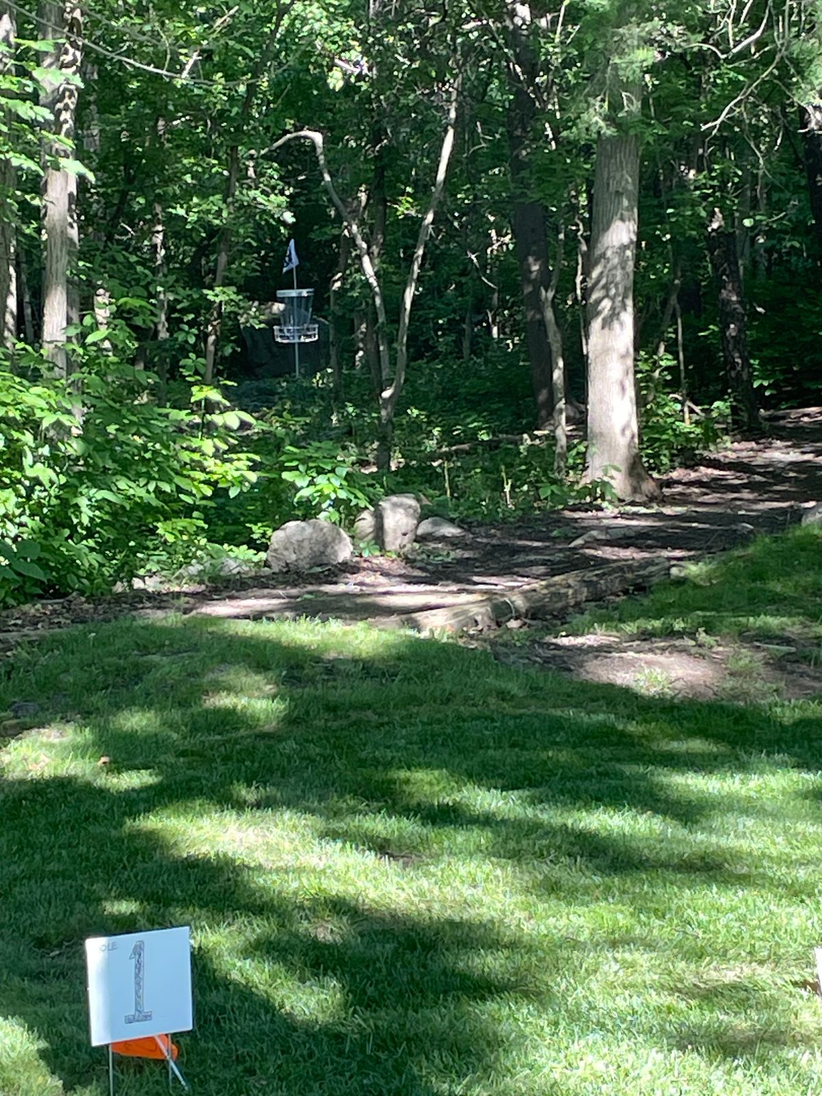 Hole one tee short very tight tunnel shot with a huge boulder backdrop