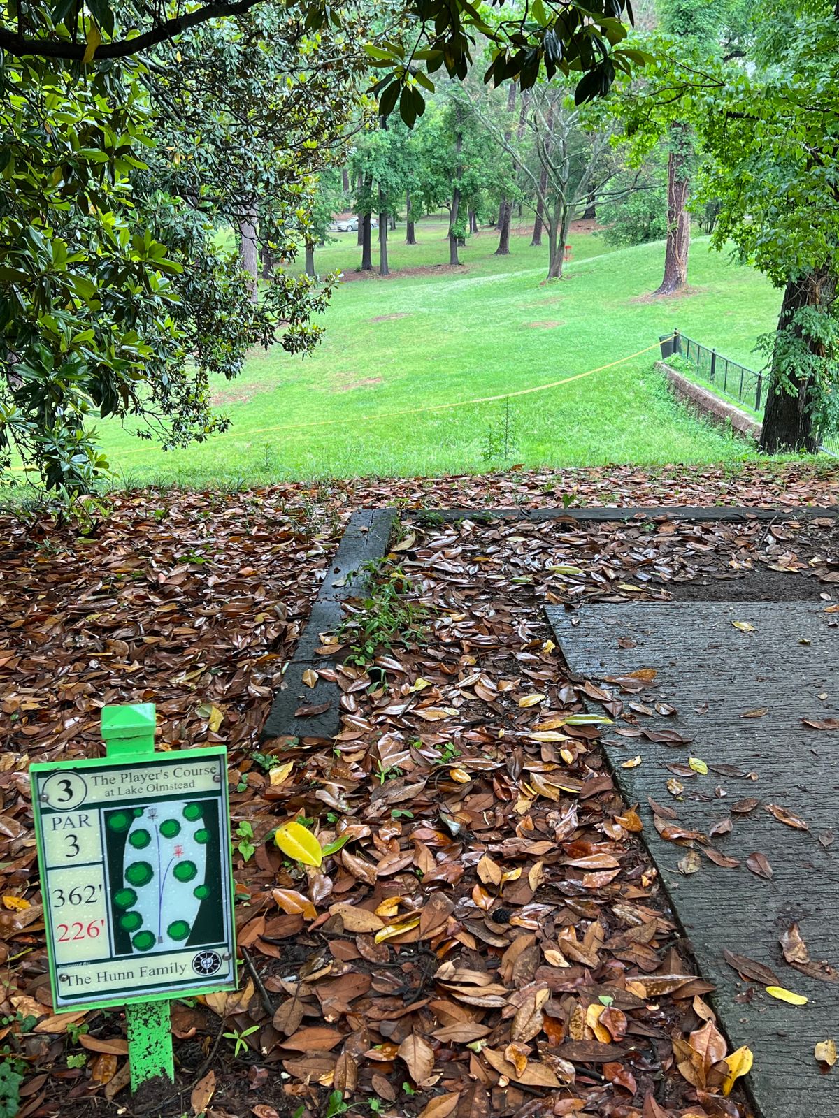 Hole has short red and long yellow basket. 