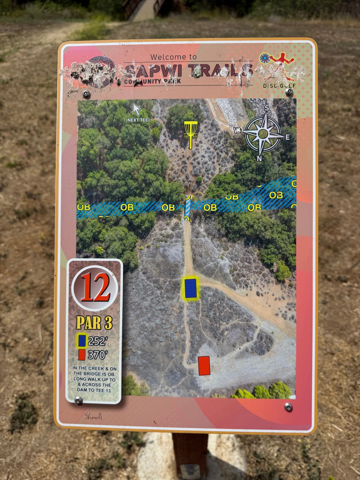 Sign hole 12