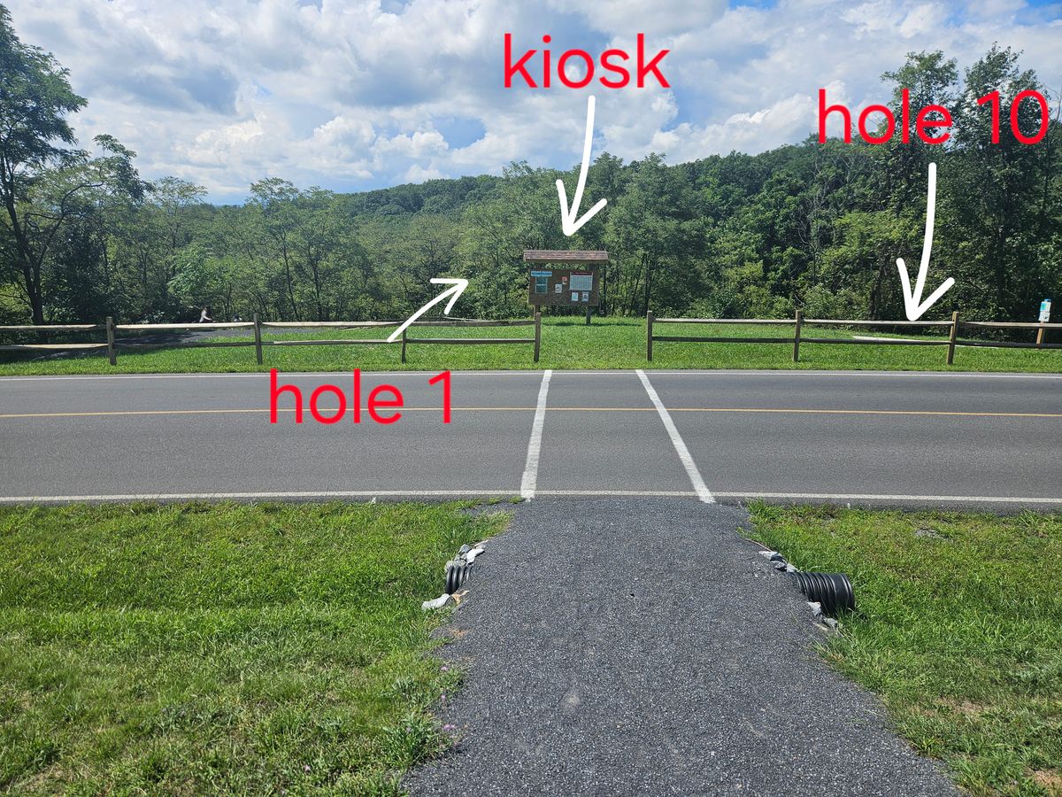 View of crosswalk to the Ravine 18 kiosk, hole 1 and hole 19