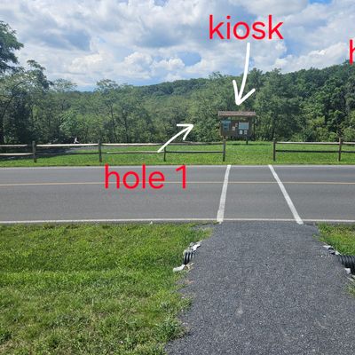 View of crosswalk to the Ravine 18 kiosk, hole 1 and hole 19