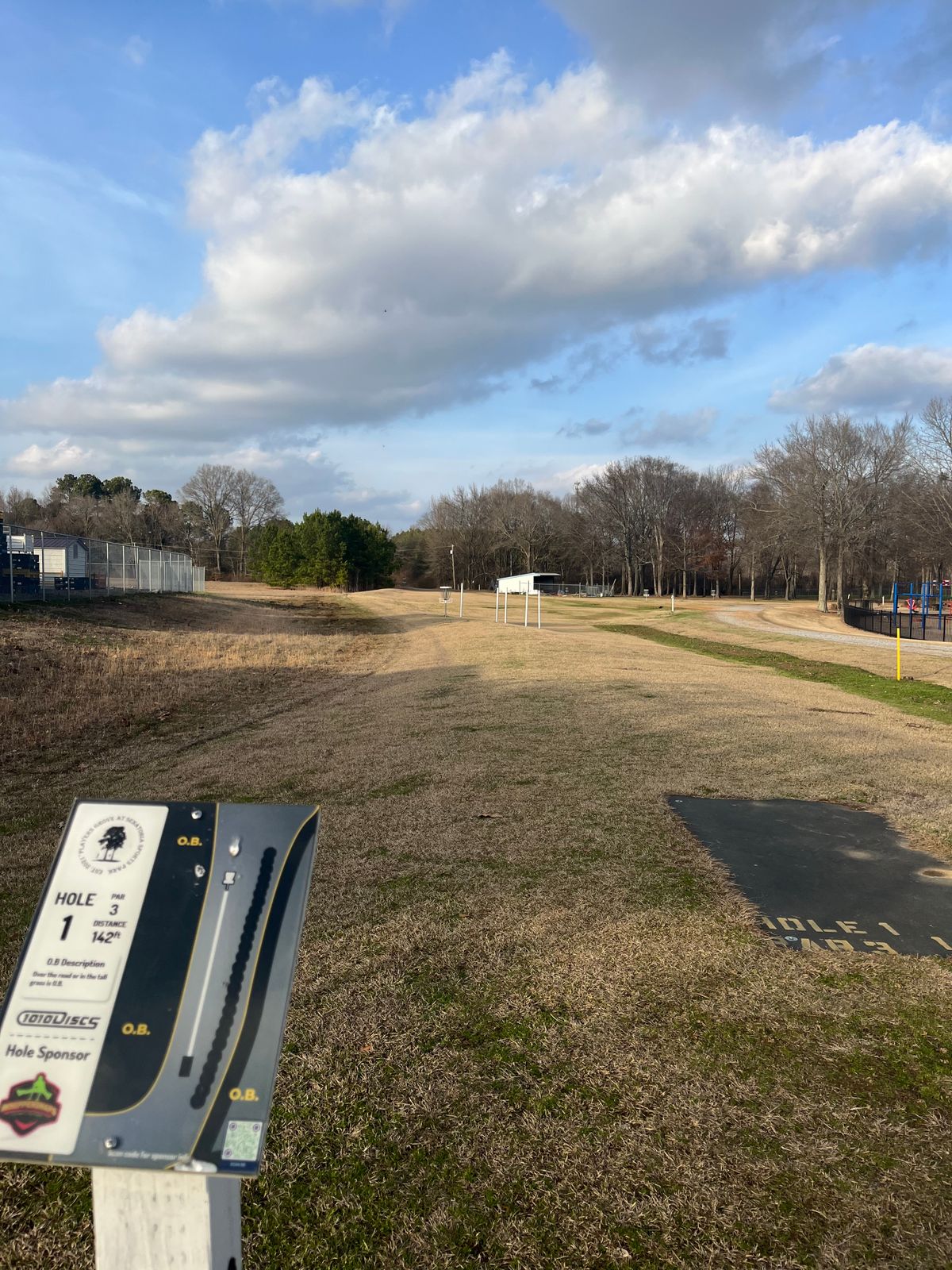 Hole 1. Poles that were on Hole 9 have been moved to Hole 1.